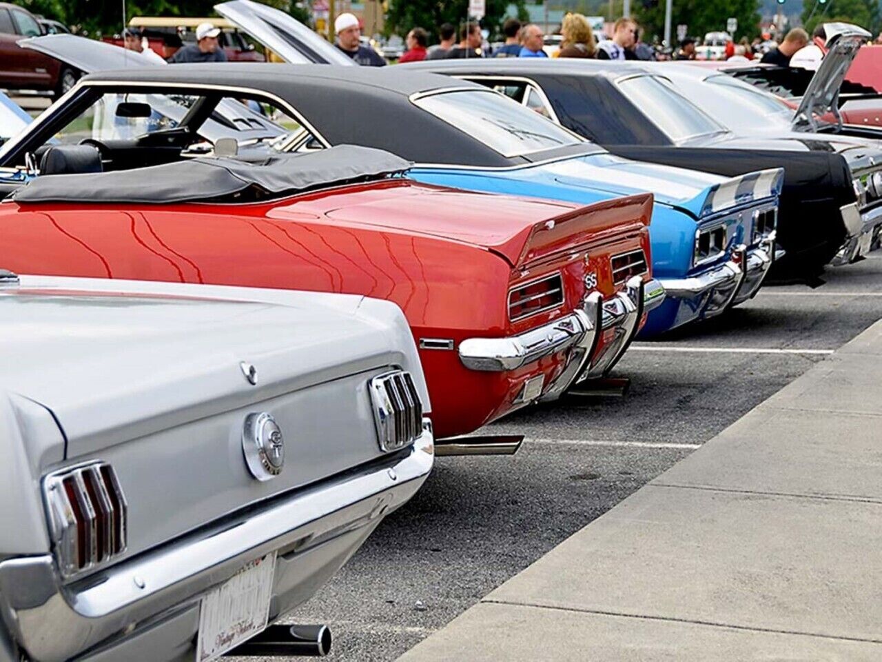 A row of vintage cars parked in a line.