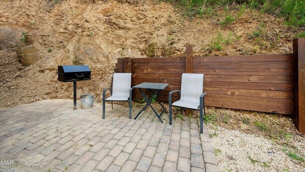 Terrace/patio - Hillside Retreat, Modern 2BR Cabin | Hot Tub, Pool Table & Fire Pit (Sevierville)