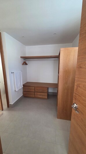 A room with a wooden desk, a hanging towel, and a door. - Sophisticated 3 to 7 bedroom Royal Villas @ Lifestyle Holidays, Puerto Plata, DR (Cofresi)