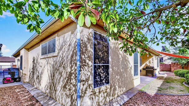 A house with a stucco exterior, a garage, and a well-maintained lawn. - Comfort & Convenience close to Zion, Sand Hollow, Quail Creek & Gooseberry Mesa! (Hurricane)