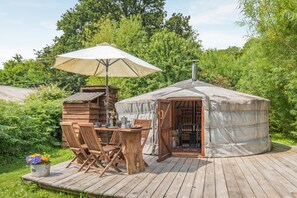 A wooden deck with a table and chairs under a canopy, a covered outdoor seating area, and a small wooden structure. - 1 Bed in Blackborough (oc-w42630) (Blackborough)