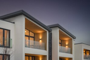 A modern multi-story residential building with balconies and large windows. - 2 Bed in Bude (oc-b588790) (Bude)