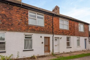 A two-story residential building with a brick facade, white-painted lower walls, and a visible chimney. - 2 Bed in Rye (oc-s43273) (Rye Harbour)