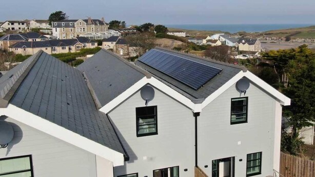 A residential building with a sloped roof, satellite dish, and a solar panel. - 4 Bed in Porth (oc-b584252) (Newquay)