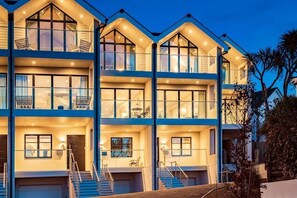 A multi-story building with balconies, staircases, and a garage. - 4 Bed in Porth (oc-b588791) (Newquay)