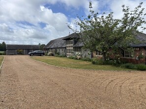 A gravel driveway leading to a house with a car parked in the driveway. - 2 Bed in Crundale (oc-c45424) (Crundale)