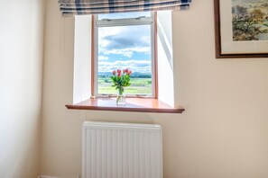 A room with a window, a radiator below, and a framed picture on the wall. - 4 Bed in Longforgan (oc-w42661) (Longforgan)