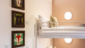 A bunk bed room with a window, a wall-mounted light, and framed artwork. - 2 Bed in Wichenford (oc-t45441) (Ockeridge)
