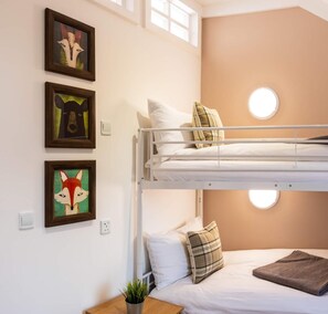 A bunk bed room with a window, a wall-mounted light, and framed artwork. - 2 Bed in Wichenford (oc-t45441) (Ockeridge)
