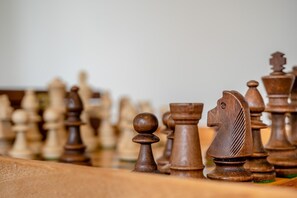 A close-up of a chessboard with wooden pieces. - 1 Bed in Bournheath (oc-h45428) (Catshill)