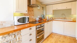 A kitchen with a microwave, oven, and sink. - 3 Bed in Waddington (oc-c45566) (Waddington)