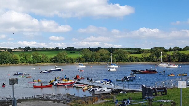 A lakeside view with boats docked, a pier, and a grassy landscape. - 1 Bed in St. Dogmaels (oc-m45322) (Saint Dogmaels)