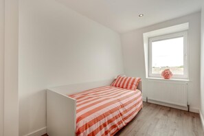 A small, single-bed room with a window, white walls, and a radiator. - 3 Bed in Rustington (oc-p45430) (Rustington)