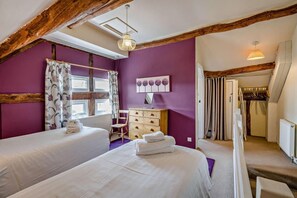 A bedroom with two beds, a dresser, a chair, and a window with curtains. - 1 Bed in Cradley (oc-w45725) (Cradley and Storridge)