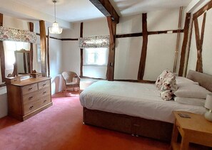 A bedroom with a bed, dresser, chair, and a window. - 2 Bed in Cradley (oc-h45727) (Cradley and Storridge)