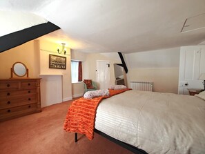 A bedroom with a bed, dresser, and a painting on the wall. - 3 Bed in Owermoigne (oc-v42806) (Owermoigne)