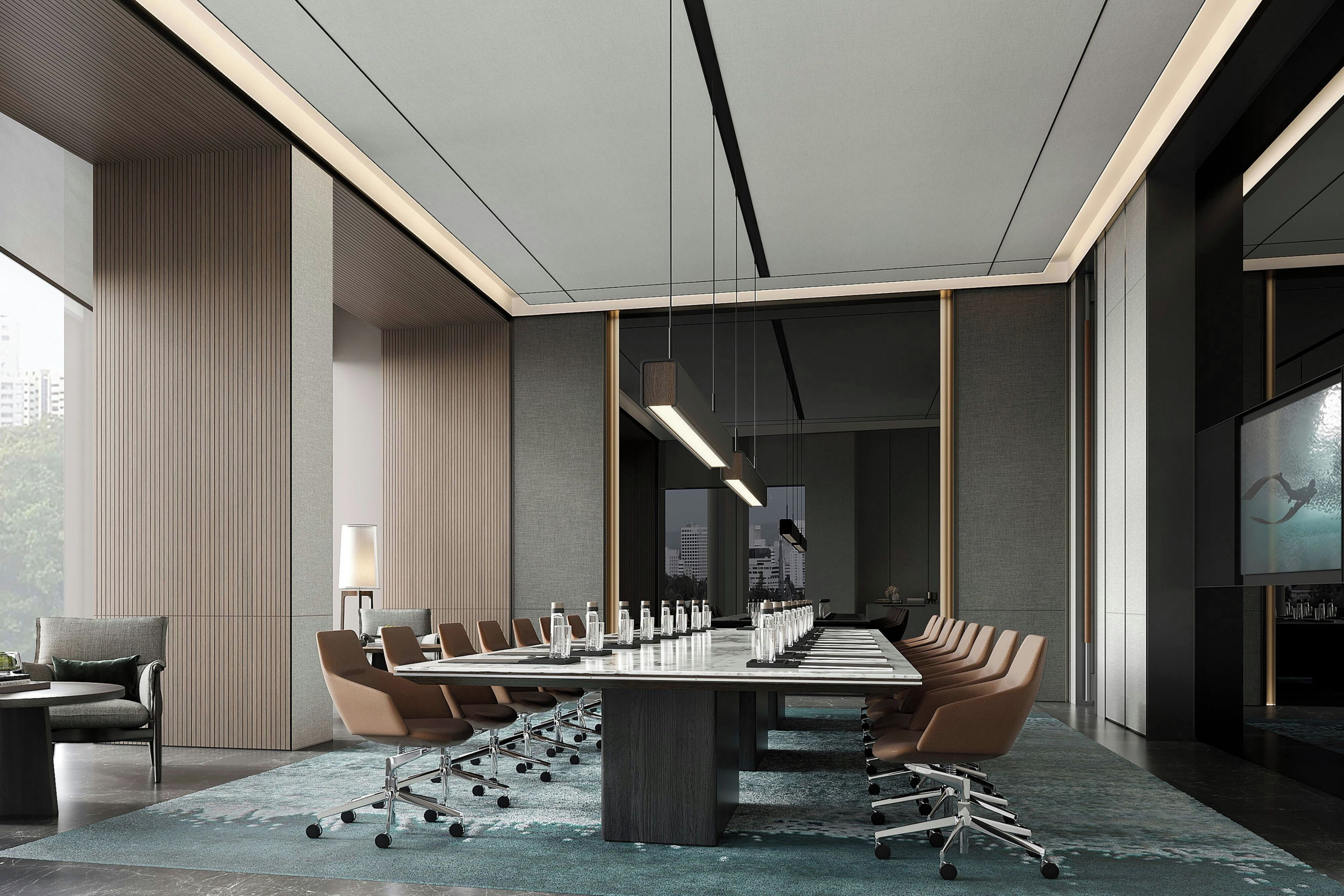 A conference room with a long table, chairs, and a city view.