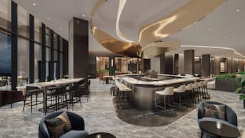 A modern bar area with a curved ceiling and seating arrangements.