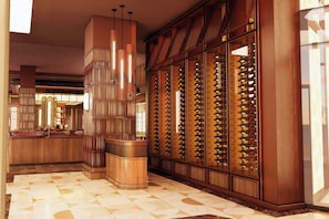 A hotel lobby with a wine cellar, a bar area, and a patterned floor. - JW Marriott Detroit Water Square (Detroit)