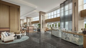 A spacious lobby with a reception desk, seating area, and large windows offering views. - Courtyard By Marriott Guilin Downtown (Guilin)