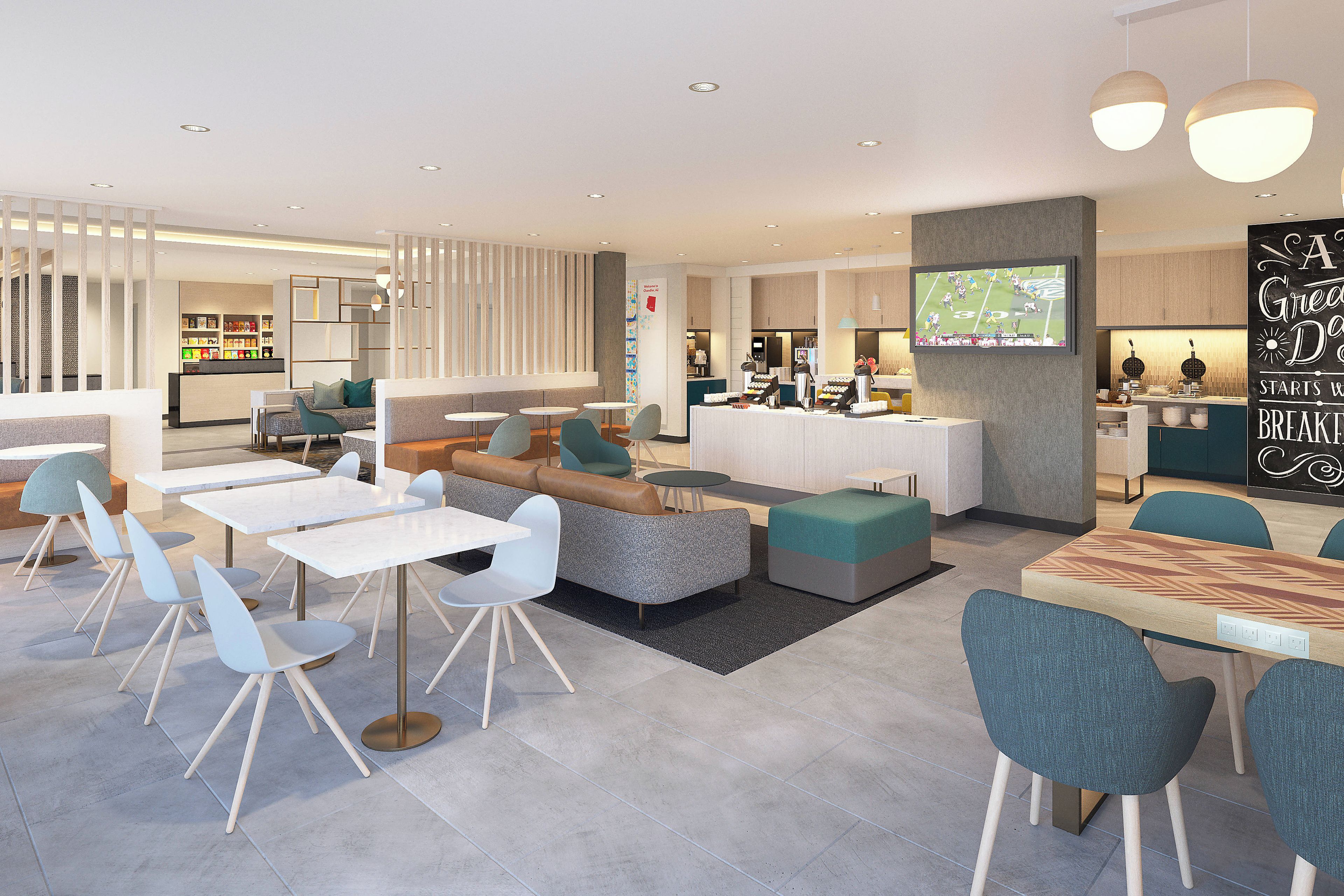 A modern cafe with seating areas, a counter, and a television screen.