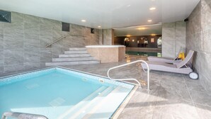 A swimming pool with a sun lounger and a reception desk. - 1 Bed in Berrier (oc-g45742) (Hutton)