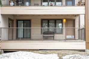 A two-story building with a balcony, a door with the number 102, and a window with a metal railing. - Great location. Your Beaver Creek + Vail Basecamp (Avon)