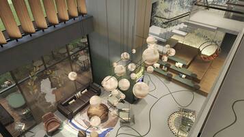 Un intérieur moderne comprenant un coin salon, une cheminée et un bar.