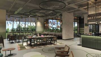 A modern restaurant interior with a bar area, dining tables, and chairs.