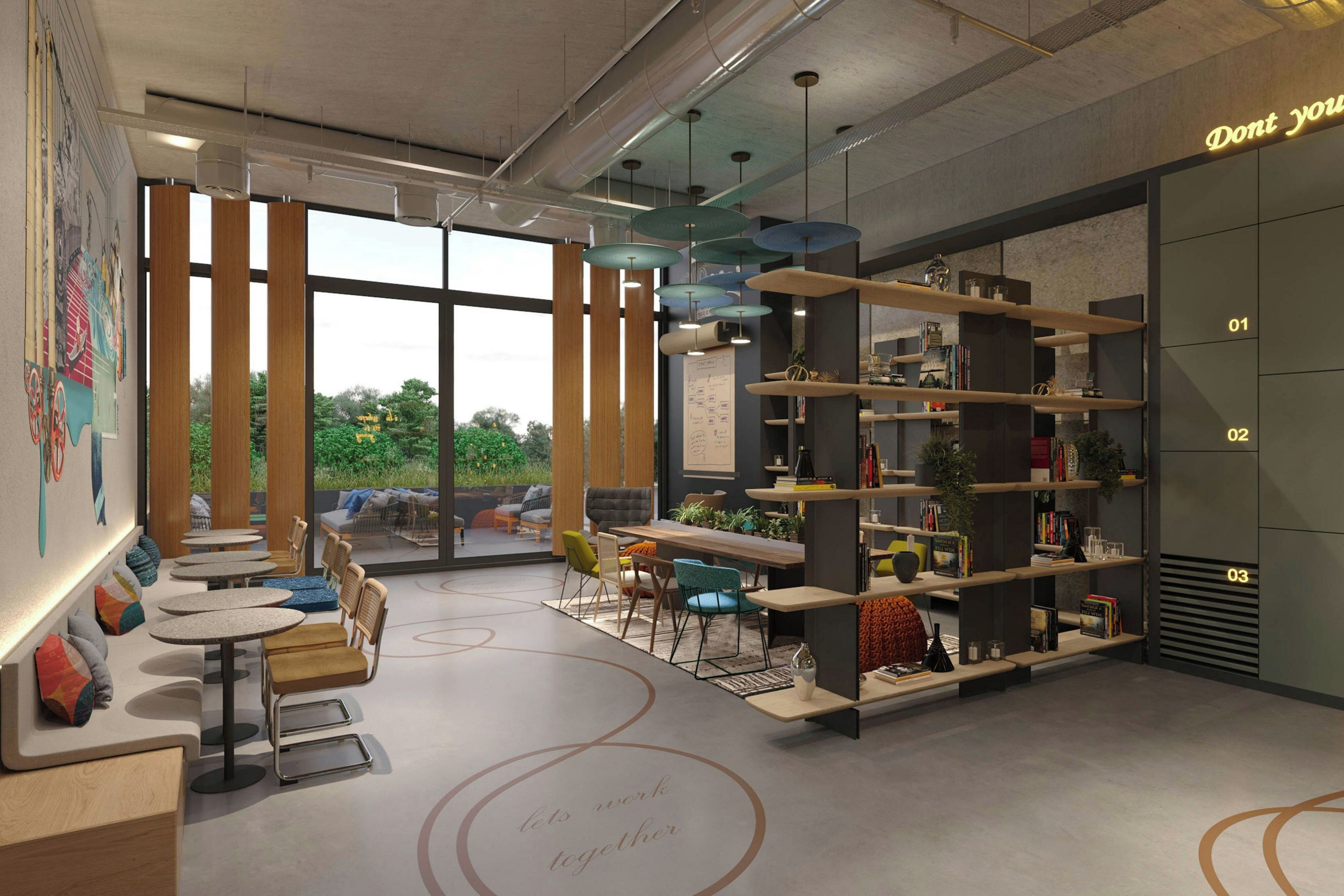 A modern interior with a seating area, bookshelves, and a large window providing a view of greenery.