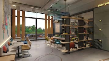 A modern interior with a seating area, bookshelves, and a large window providing a view of greenery.