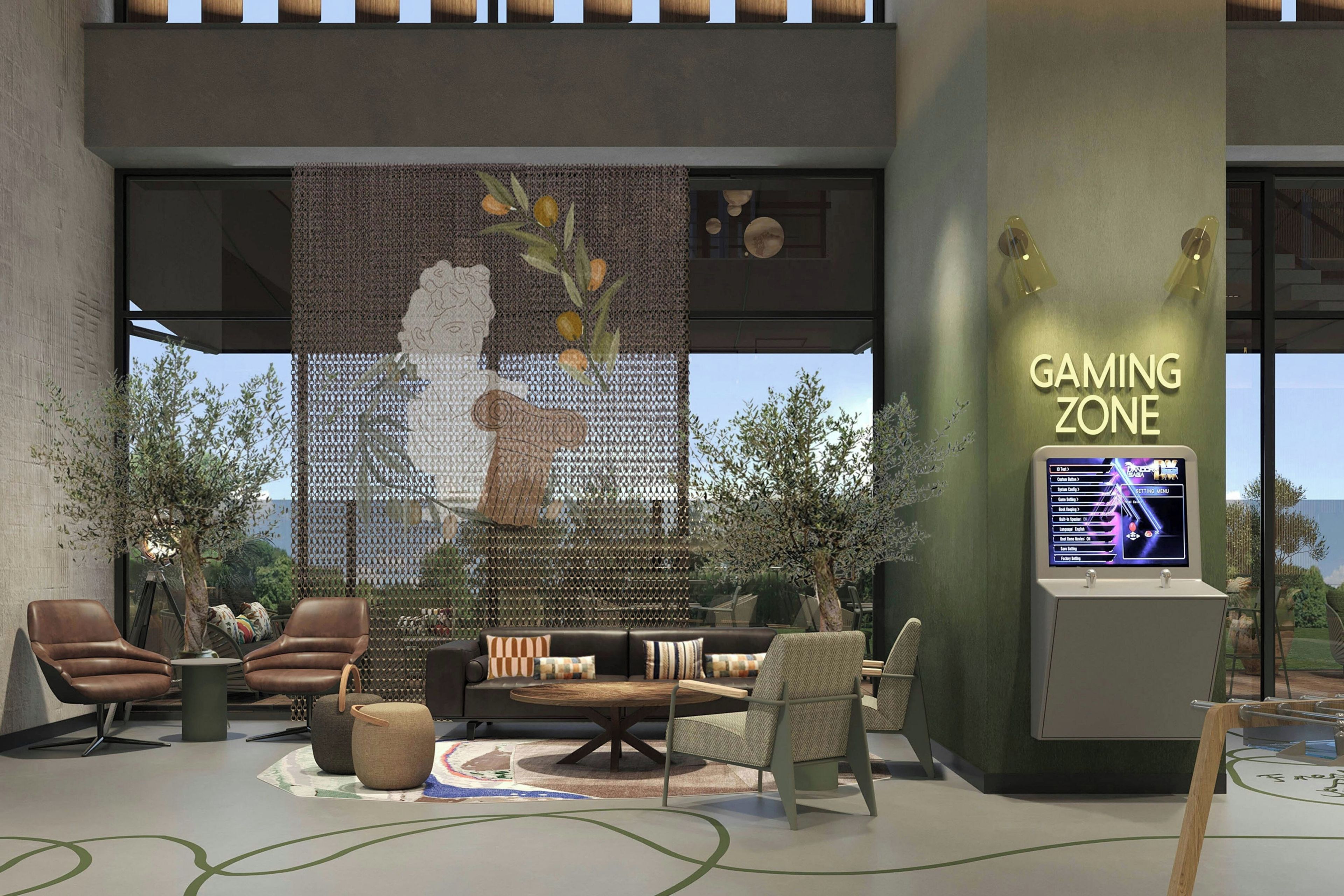 A gaming zone with a large screen, seating area, and a decorative wall.