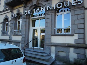 A building with the sign 'LES BRITANNIQUES' indicating a hotel or similar establishment. - Charm and comfort** for a family vacation in La Bourboule (La Bourboule)