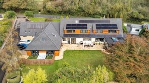 A modern two-story house with solar panels, a swimming pool, and a well-maintained lawn. - 6 Bed in Oakhill (oc-l33610) (Oakhill)
