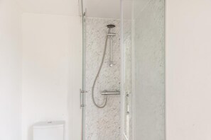 A shower with a handheld showerhead and a wall-mounted faucet. - 1 Bed in St. Florence (oc-s33553) (Saint Florence)