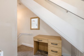 A room with a wooden desk, a mirror, and a carpeted floor. - 3 Bed in Whitby (oc-c40269) (Whitby)