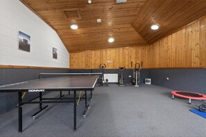 An indoor sports facility with a ping pong table, exercise equipment, and a trampoline. - 1 Bed in Milton Abbas (oc-l35018) (Milton Abbas)