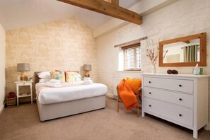 A bedroom with a bed, bedside tables, a dresser, a window with blinds, and a mirror. - 2 Bed in Cranmer (oc-o45790) (Cranmer)