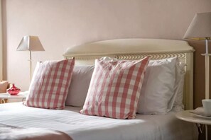 A hotel room with a bed, pillows, a bedside table, and a lamp. - 2 Bed in Cranmer (oc-w45791) (Cranmer)