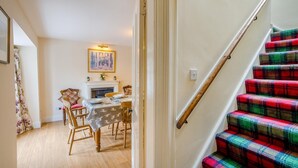 A staircase with a wooden handrail and a red plaid carpet. - 2 Bed in Newtyle (oc-b45543) (Newtyle)