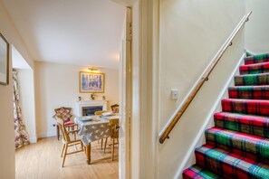 A staircase with a wooden handrail and a red plaid carpet. - 2 Bed in Newtyle (oc-b45543) (Newtyle)