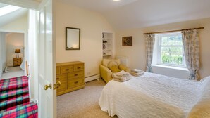A bedroom with a bed, a dresser, a chair, a window with curtains, and a lamp. - 2 Bed in Newtyle (oc-b45543) (Newtyle)