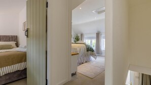 A bedroom with a bed, a bedside table, and a window. - 2 Bed in Great Massingham (oc-a45882) (Great Massingham)
