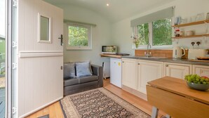 A compact kitchen with a built-in oven, a sink, and a small refrigerator. - 1 Bed in Laddingford (oc-s45858) (Laddingford)