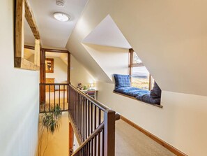 A staircase leading to a loft bedroom with a view of the countryside. - 4 Bed in Boat Of Garten (oc-78920) (Boat of Garten)