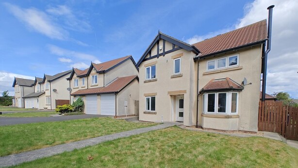 A row of two-story houses with pitched roofs, a grassy front yard, and a clear sky. - 4 Bed in Seahouses (oc-h45933) (Seahouses)