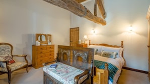 A bedroom with a wooden bed, a wooden dresser, a chair, and a nightstand. - 1 Bed in Ribchester (oc-n45957) (Ribchester)