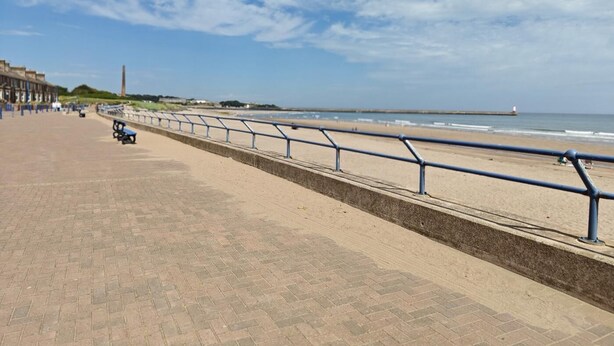 A paved promenade with a metal railing, leading to a beach. - 3 Bed in Spittal (oc-b45905) (Spittal)