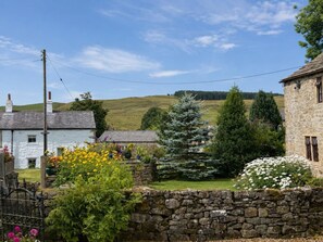 A rural landscape with stone walls, a stone house, and a coniferous tree. - 2 Bed in Bolton By Bowland (oc-m45938) (Grindleton)