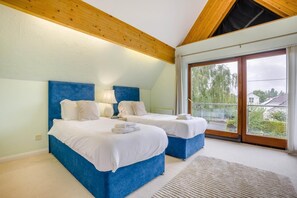 A bedroom with two beds, a large window, and a view of the outside. - 3 Bed in Christchurch (oc-m45917) (Christchurch)